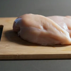 Chicken breasts on top of a cutting board